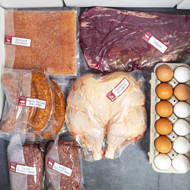 Assorted packaged meats and eggs, including ground chicken, flank steak, sausage, whole chicken, ground beef, and eggs.