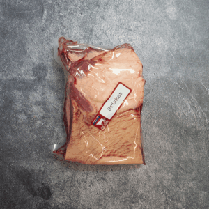 Beef brisket vacuum-sealed in clear packaging with label.