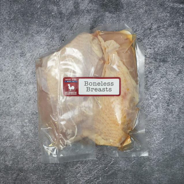 Boneless chicken breasts vacuum-sealed in clear packaging with label.