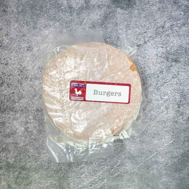 Packaged chicken burger patties with a "Burgers" label on a gray textured surface.