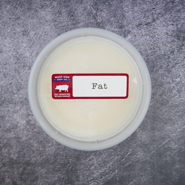 Round plastic container of pork lard with a "Fat" label on a gray textured surface.