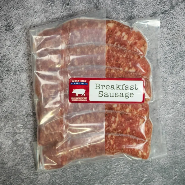 Vacuum-sealed breakfast sausage pack from West Side Beef Co. on a gray surface.