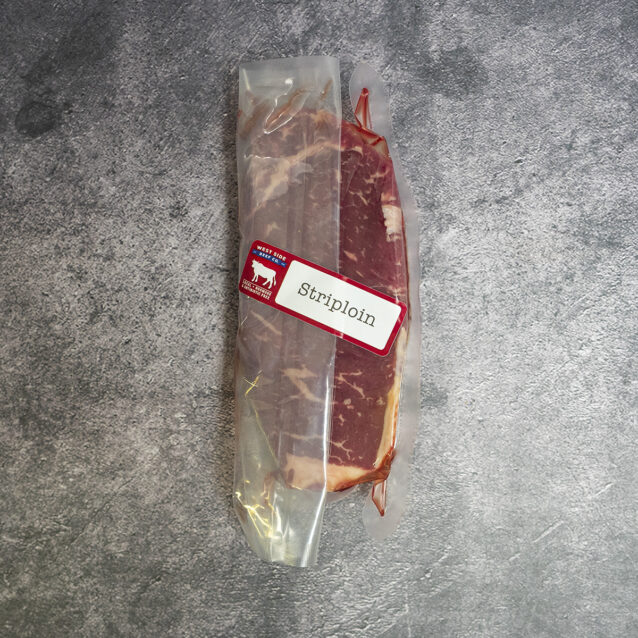 Dry-aged thick-cut striploin steak (~22 oz), vacuum-sealed.